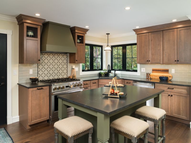 Bright, modern kitchen with updated pendant lighting, fresh cabinet hardware, and a stylish backsplash, designed by Kitchen & Bath World.
